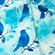 Bavlněný úplet s modrými ptáčky na větvičkách na akvarelovém pozadí