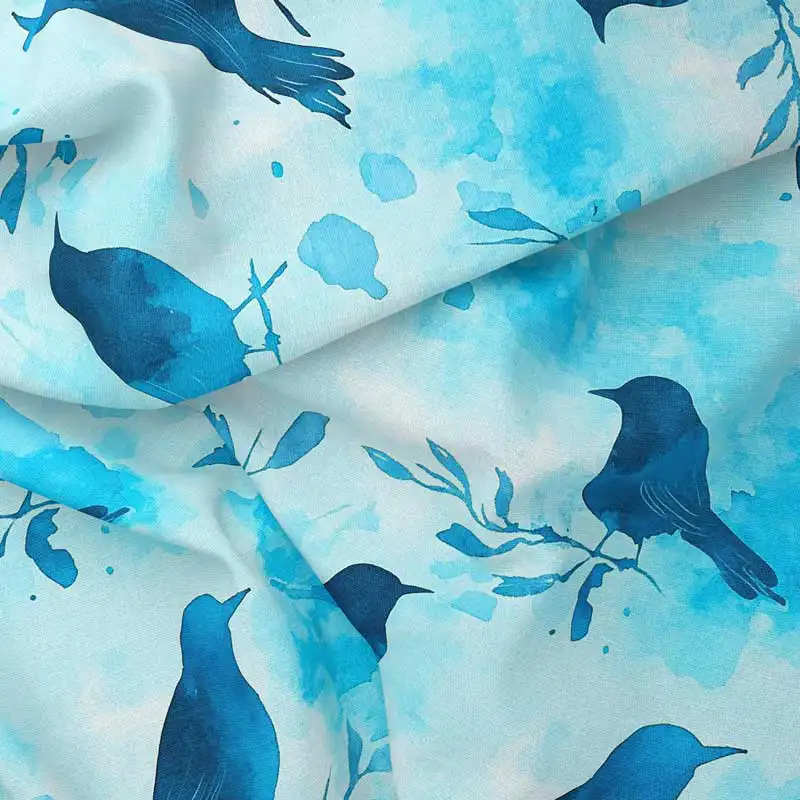 Dekorativní bavlněný úplet – modří ptáci na větvích v akvarelovém stylu